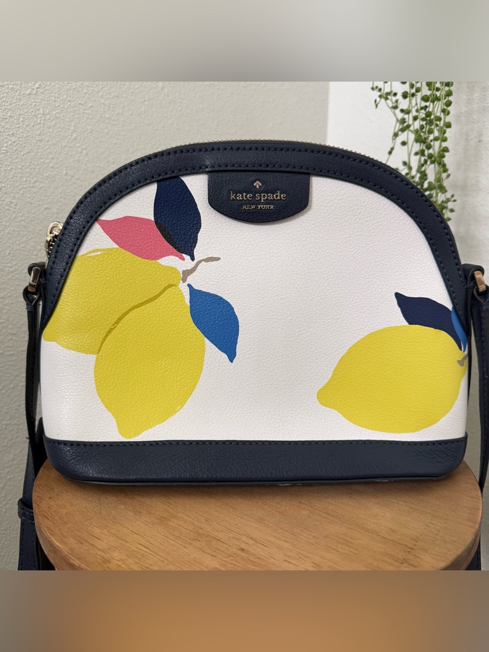 Kate Spade Sylvia domed crossbody in Lemon Zest with navy trim